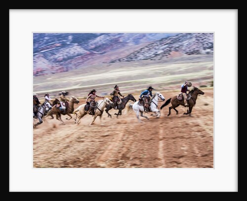 Cowboy's in motion across the field by Anonymous