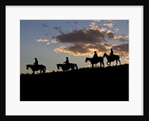 Cowboys in silhouette with sunset by Anonymous