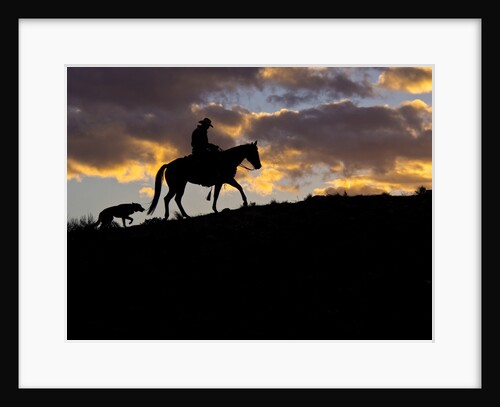 Cowboy in silhouette with sunset by Anonymous