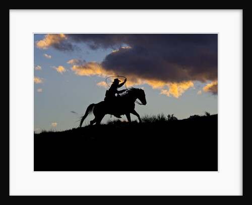 Cowboy in silhouette with sunset by Anonymous
