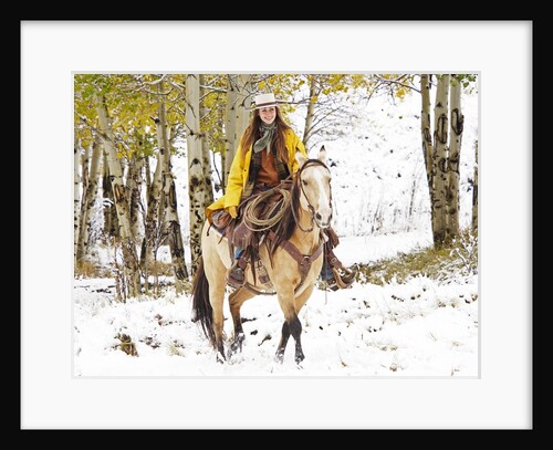 Cowgirl riding in Autumn Aspens with a fresh snowfall by Anonymous