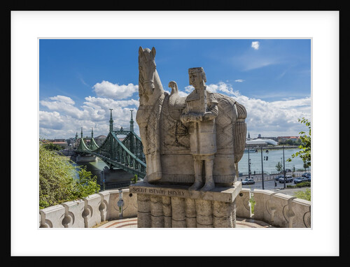 Gellert Hill), the statue of Saint Stephen near the entrance of Sziklatemplom (Church by the Rock), on the left the Szabadsag hid (Liberty Bridge or Freedom Bridge) by Anonymous