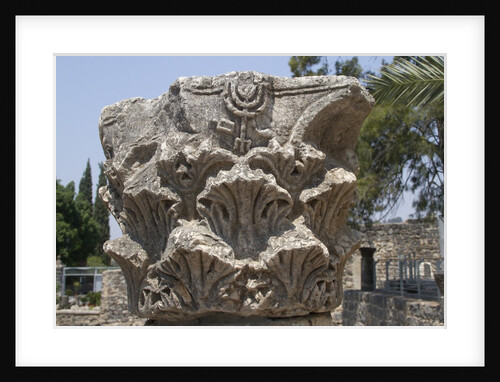 Hebrew menorah carved into stone capital in Roman town of Capernaum by Anonymous