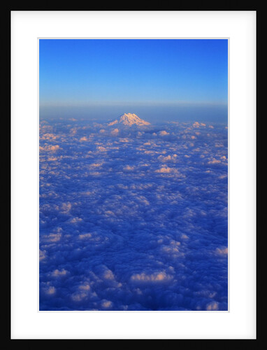 The Snowy Peak of Mount Rainier Rises Above the Clouds by Anonymous