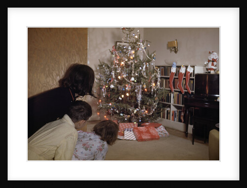 Children Peeking Around Corner at Christmas Tree by Anonymous