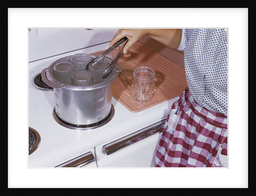 Woman Sterilizing Jars for Canning by Anonymous