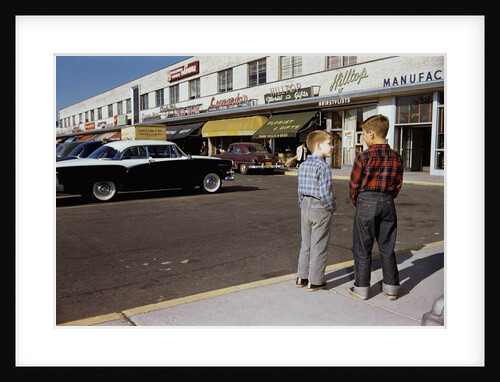 Boys Standing Alongside Strip Mall Parking Lot by Anonymous