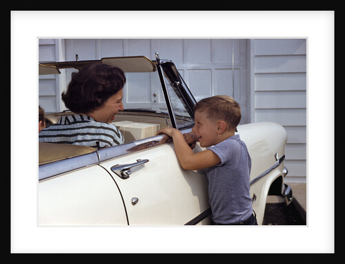 Mother Sitting in Car Laughing with Son by Anonymous