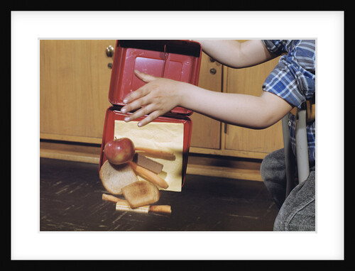 Boy Spilling Lunchbox Contents by Anonymous