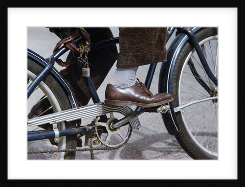 Man Riding Bicycle in Dress Shoes by Anonymous