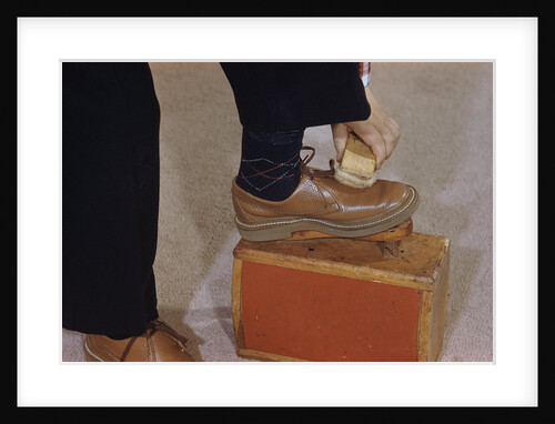 Man Buffing His Shoes by Anonymous