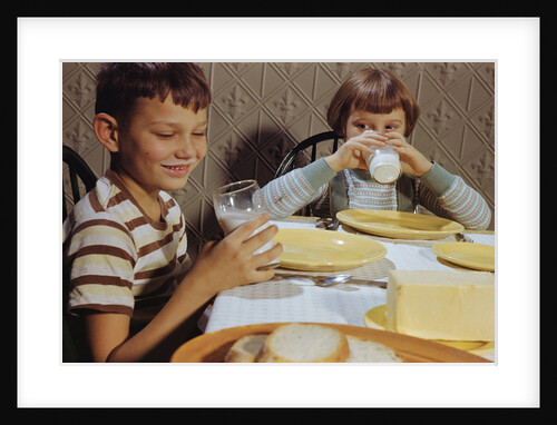Children Drinking Milk at Dinner Table by Anonymous