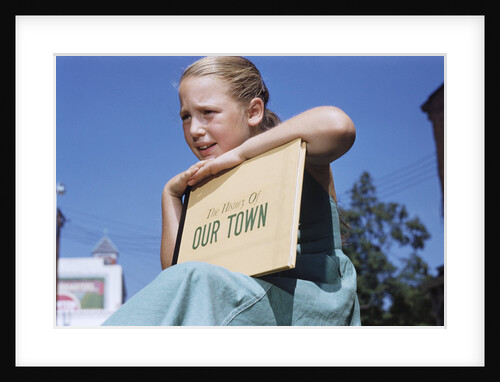 Girl Holding Town History Book by Anonymous