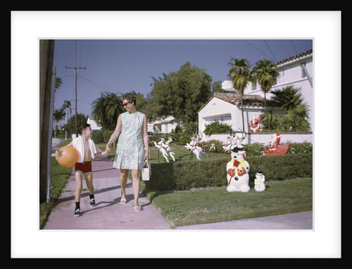 Mother and Son Walking by Christmas Decorations on Yards by Anonymous