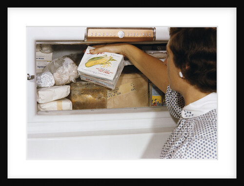 Woman Holding Box of Frozen Corn by Anonymous