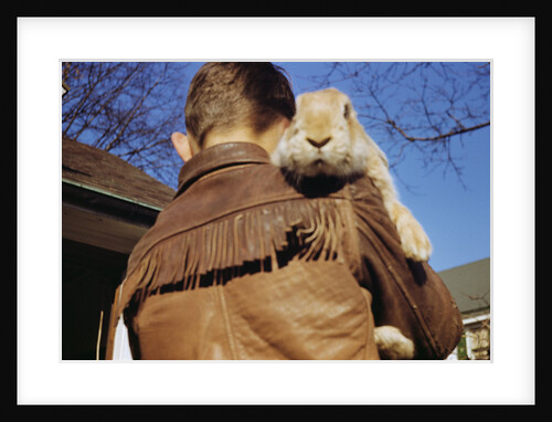 Boy Carrying Rabbit by Anonymous