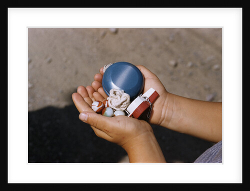 Child Holding Toys by Anonymous