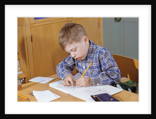 Boy Working on His Schoolwork by Anonymous