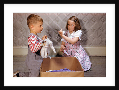 Boy Holding Kitten by Anonymous