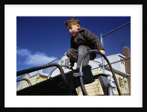 Boy Playing on Playground Slide by Anonymous