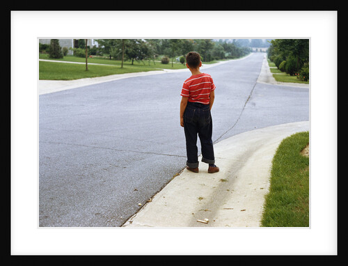 Boy Waiting on Suburban Street by Anonymous