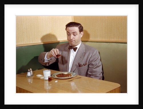 Businessman Pouring Syrup on Pancakes by Anonymous