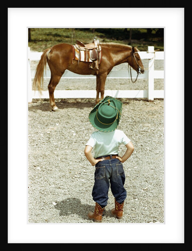 Young Cowboy Looking at Horse by Anonymous