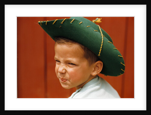 Boy in Cowboy Hat Making Funny Face by Anonymous