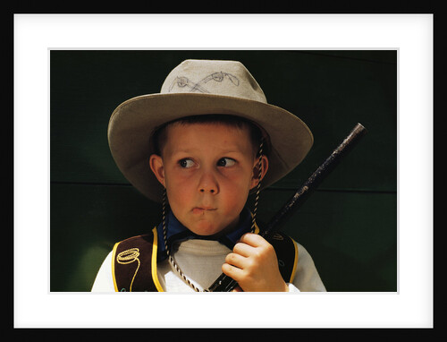 Boy Playing Cowboy with Gun by Anonymous