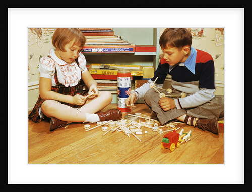 Boy and Girl Playing with Tinkertoys by Anonymous