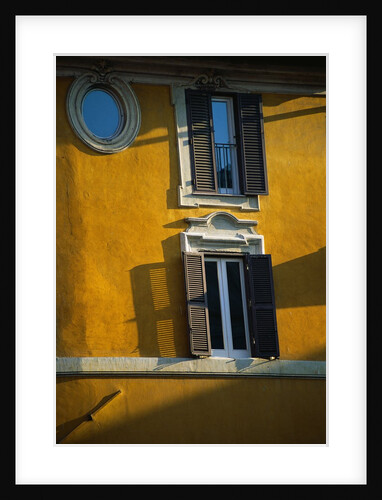 Shuttered Windows on Yellow Building by Anonymous