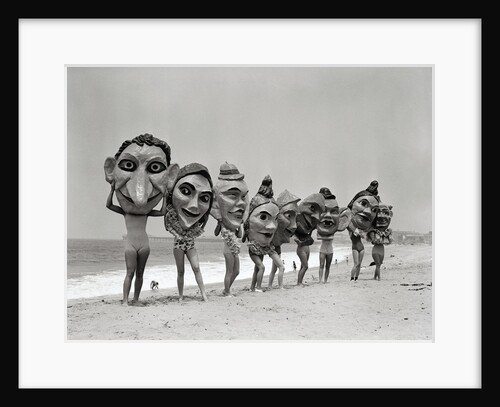 Women Holding Giant Masks by Anonymous
