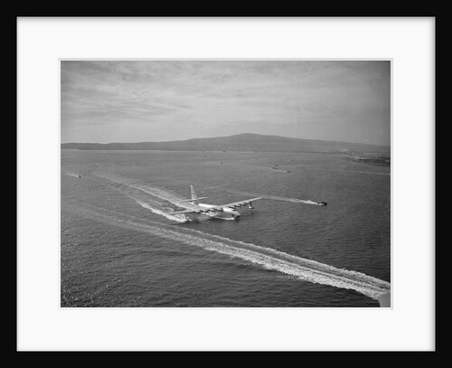 Howard Hughes' Spruce Goose Taxiing Across Water by Anonymous