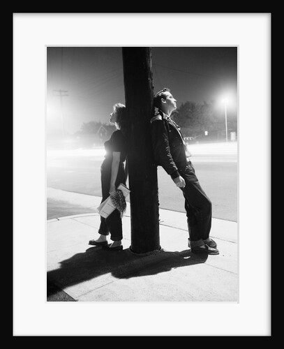 Teenagers Leaning on Utility Pole by Anonymous