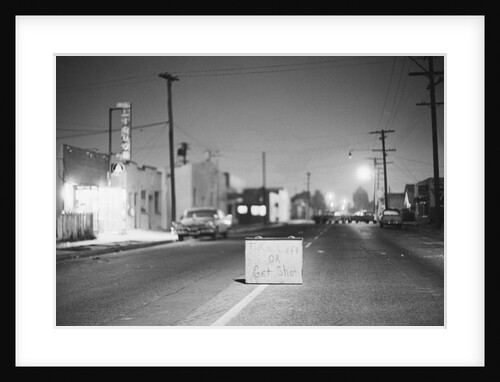 Turn Left Or Get Shot Sign In Street by Anonymous