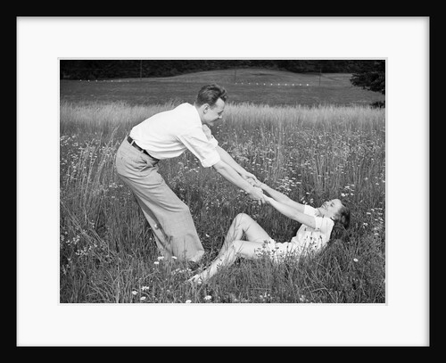 Young Couple Frolicking in Grass by Anonymous