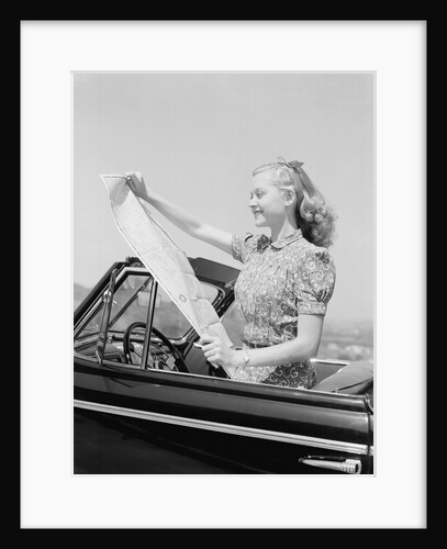Young Woman Reading Road Map by Anonymous