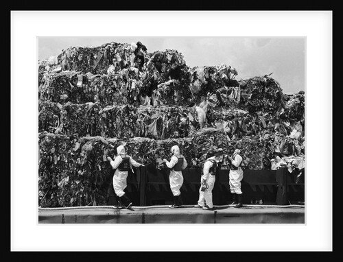 Workers Inspecting Garbage On Barge by Anonymous