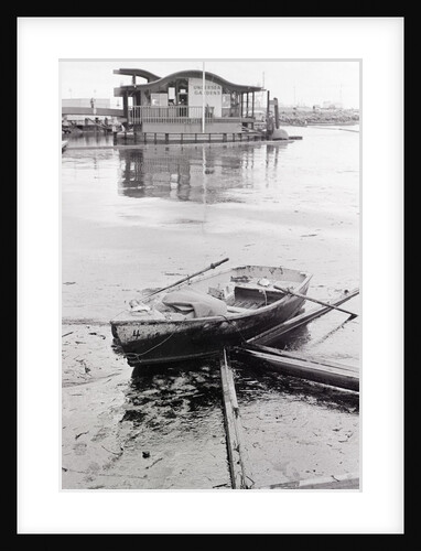 Oil-Slicked Boat Washed On Oiled Beach by Anonymous