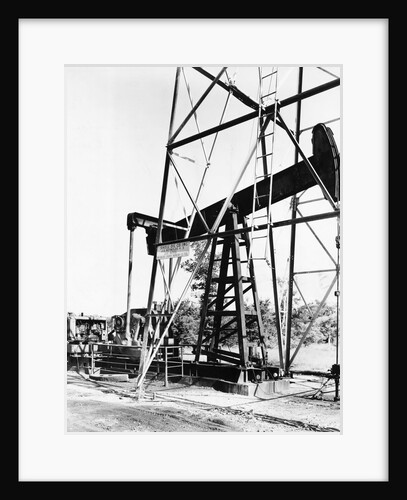 Oil Derrick Pumping Closer Up by Anonymous
