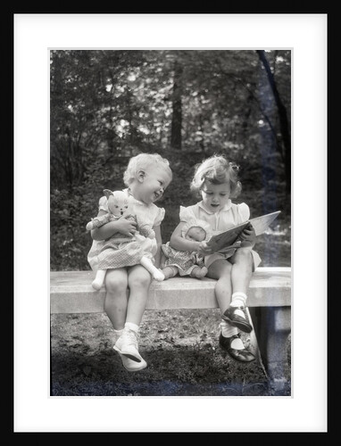 Two Little Girls Sitting On A Bench by Anonymous