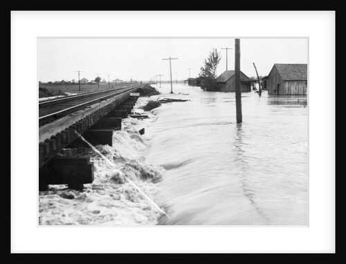 River Flood Waters Wash Around Rr Trestl by Anonymous
