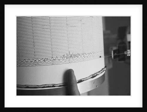 Finger Pointing to Earthquake Reading on Seismograph by Anonymous