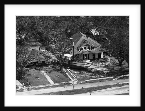 Boat Rests Against A House Aft Hurricane by Anonymous