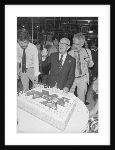 Buckminster Fuller Cutting Birthday Cake by Anonymous