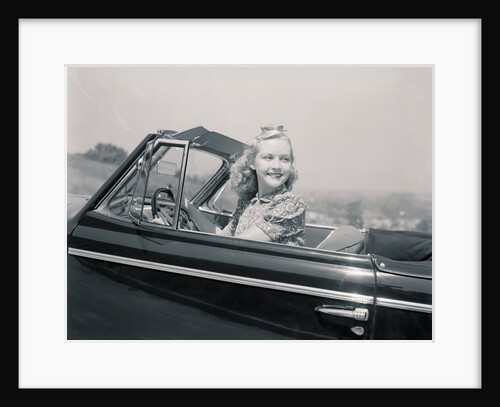 Blonde Woman Driving a Convertible by Anonymous