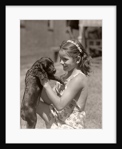 Girl Holding Puppy by Anonymous