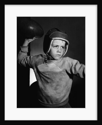 Boy Throwing a Football by Anonymous