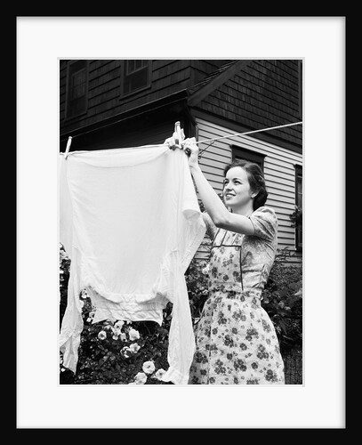 Woman Hanging Laundry Out to Dry by Anonymous