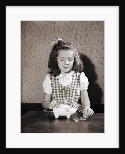 Girl Putting Change Into Piggy Bank by Anonymous